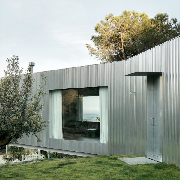 Metal exterior of coastal home by Jaime Prous Architects and Pineda & Monedero