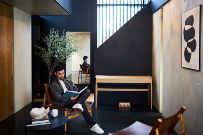 Man sitting by piano