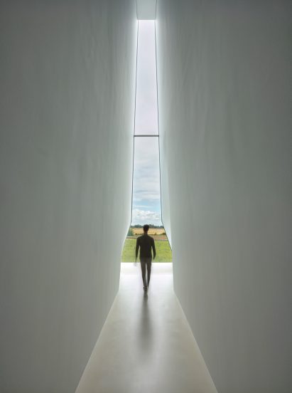 Person walking through The Lost Shtetl Jewish Museum by Lahdelma & Mahlamäki Architects