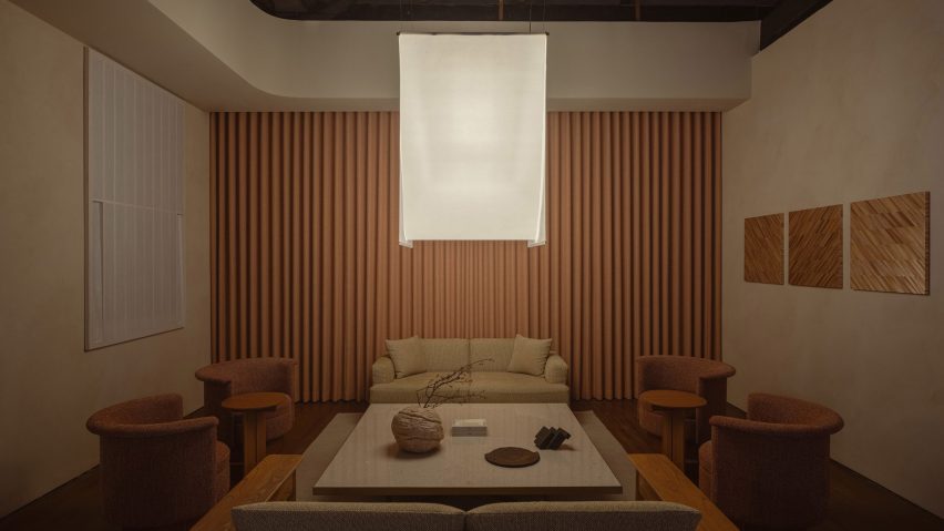 Washi-paper lamp above grey table