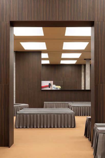 Grey pleated-fabric covered benches