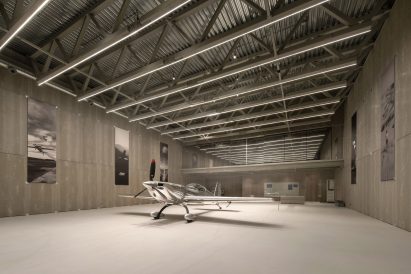 Aircraft hangar with silver plane
