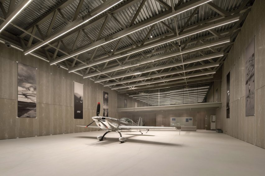 Aircraft hangar with silver plane