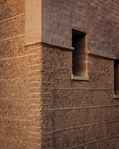 Window of Rammed Earth House by Tuckey Design
