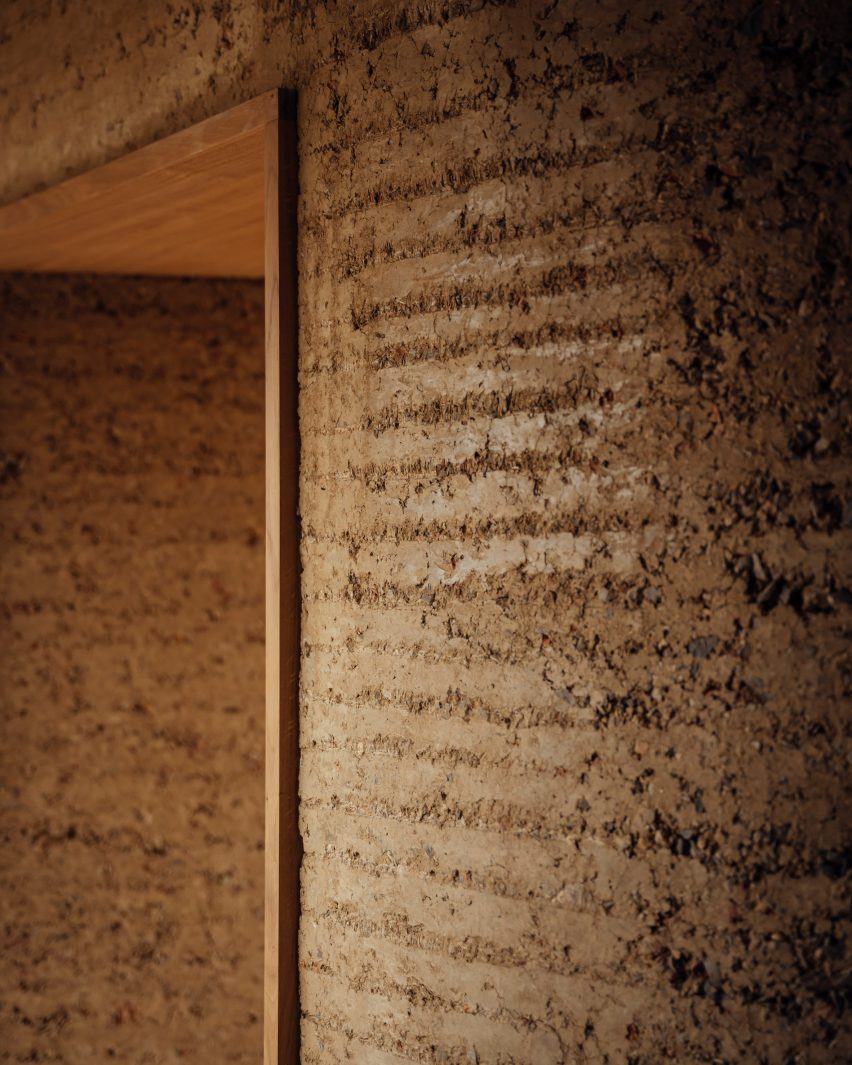 Wall detail inside Rammed Earth House by Tuckey Design