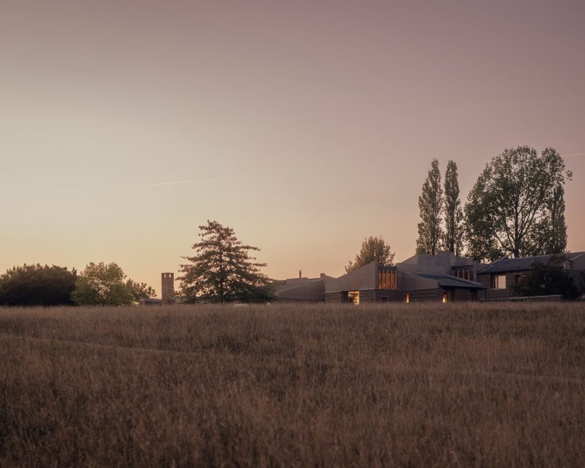 Night view of Rammed Earth House by Tuckey Design