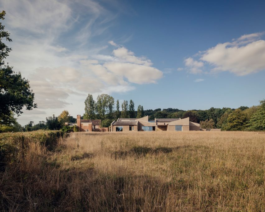 Distant view of Rammed Earth House by Tuckey Design
