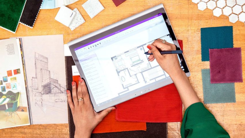 person drawing architectural plan on tablet