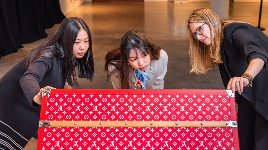 people looking at a luxury item
