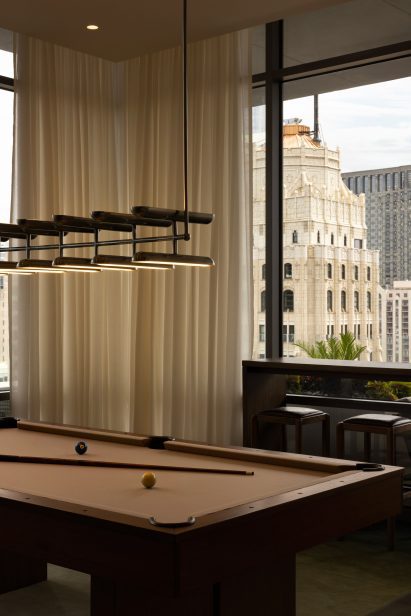 Pool table in curtained-lined games room