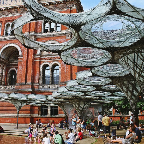 Photograph of people gathering by an installation in the V&A Museum courtyard
