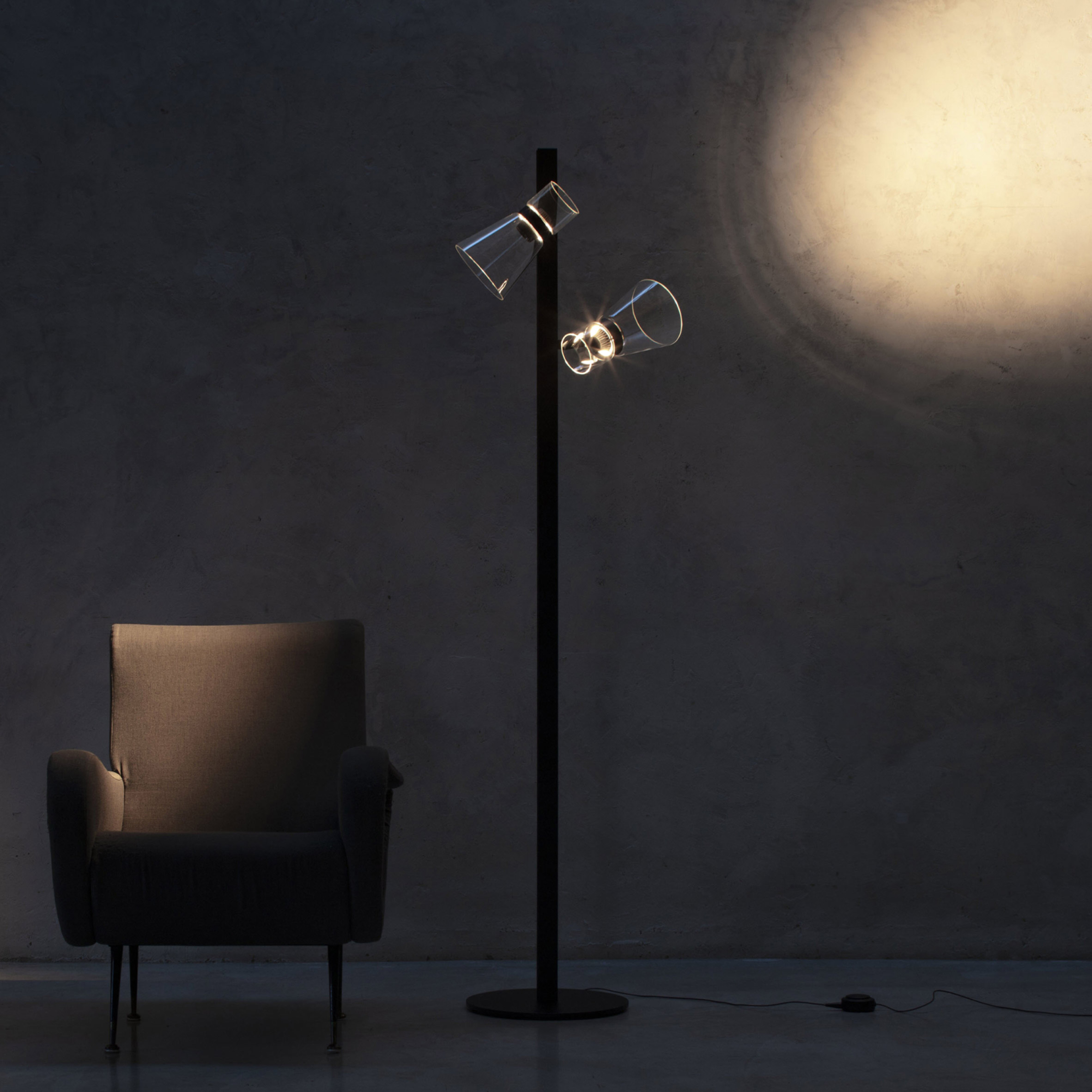 Photo of moon-inspired lamp next to armchair