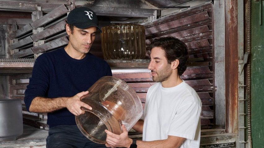 People holding glass design object