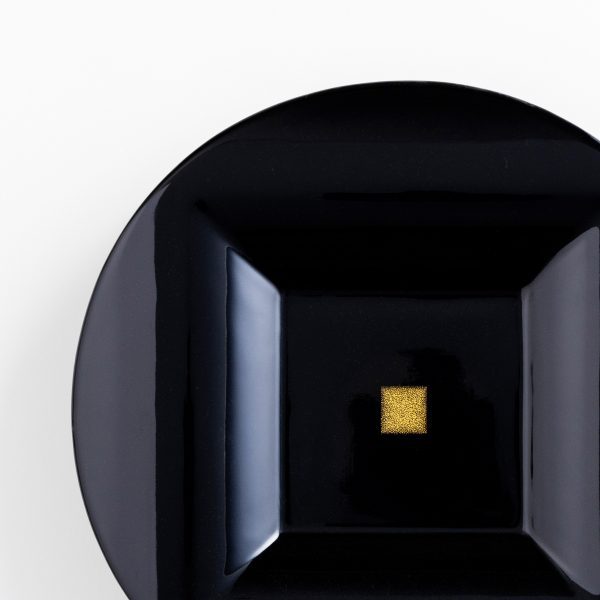 Abstract image with a black circle and gold square