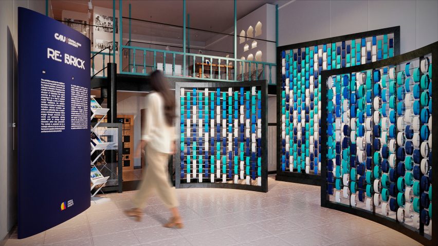 Person walking through exhibition next to an information panel
