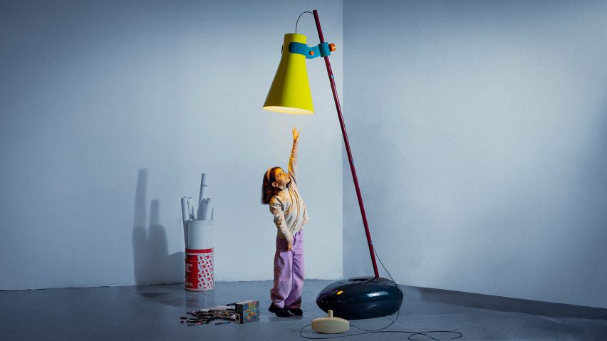Photo of a child reaching for a lamp