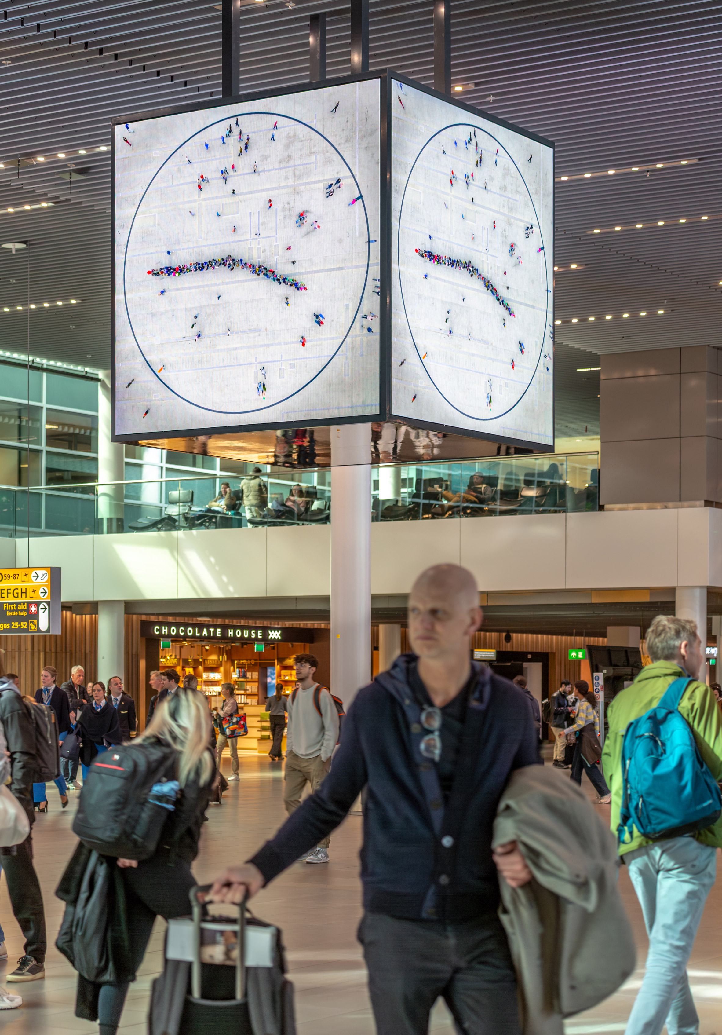 Person underneath clock