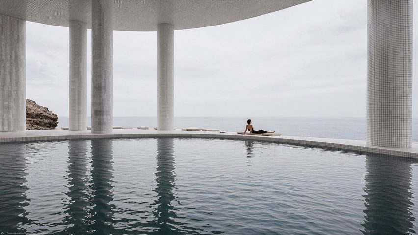 a person sat by a swimming pool