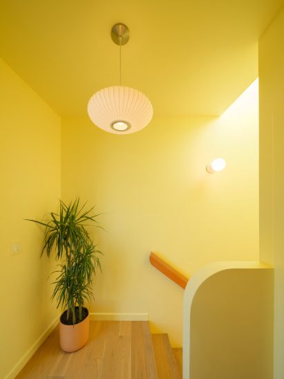 Yellow slated staircase in Los Angeles ADU