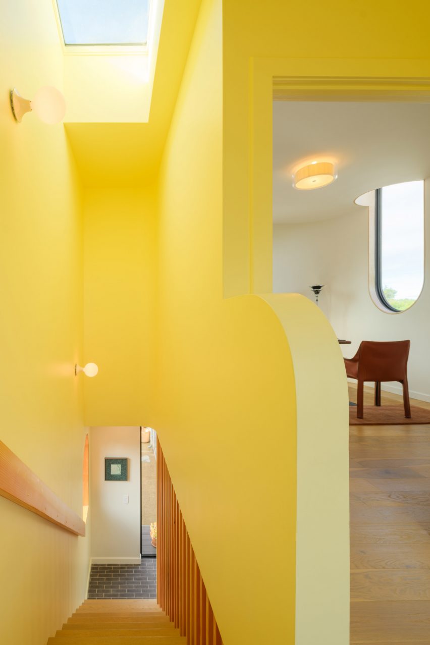 Yellow stairwell with skylight in Los Angeles ADU