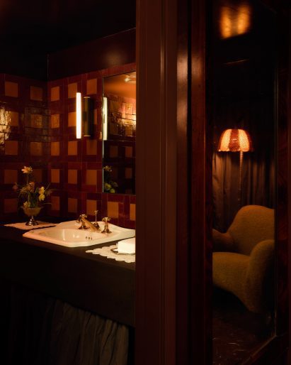 Low-lit orangey bathroom