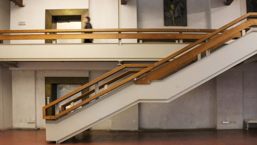 a photograph of a staircase in tones of white and brown