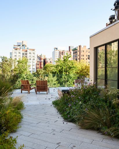 A landscaped roof terrace with views of Manhattan