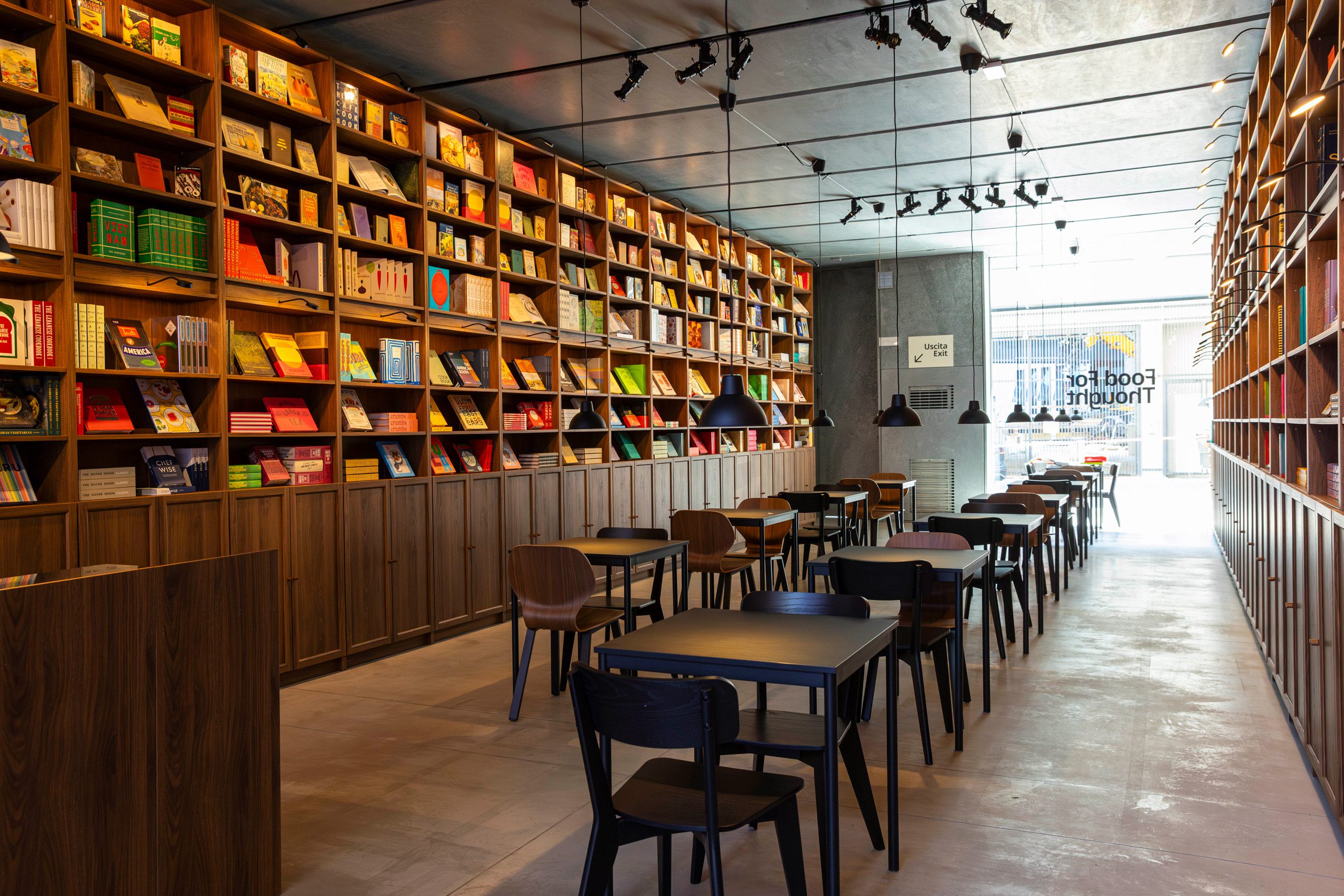 IKEA'S BILLY shelving system filled with cookbooks displayed inside the exhibition space