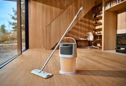 Joseph Joseph UltraClean mop and bucket system placed on a wooden floor in a domestic interior