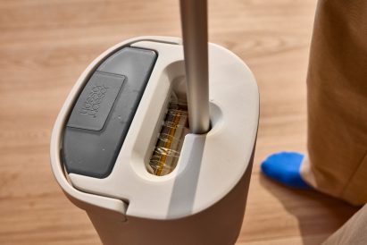 Close-up of the UltraClean bucket showing internal mechanism that sprays water onto the mop pad