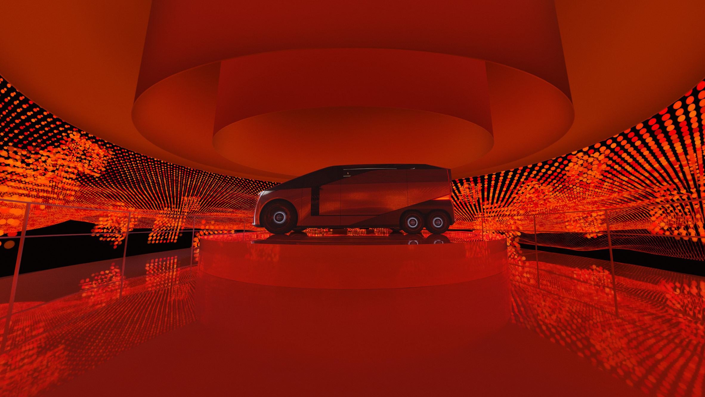 Lexus Concept vehicle in a red-lit installation with patterned light projections across the walls