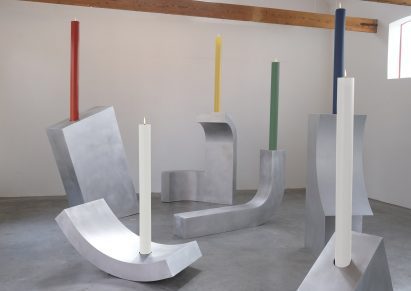 Large coloured candles in the candle holders