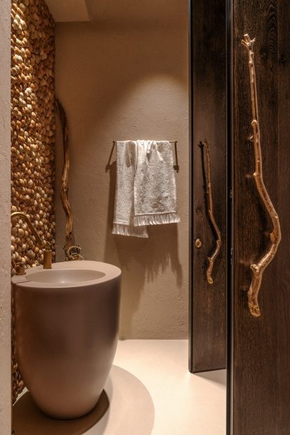 Bathroom with a knobbly ceramic wall panel