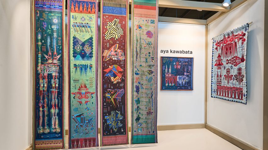 Photo of the Satellite stand by Aya Kawabata showing hanging textiles