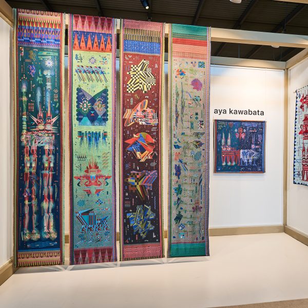 Photo of the Satellite stand by Aya Kawabata showing hanging textiles