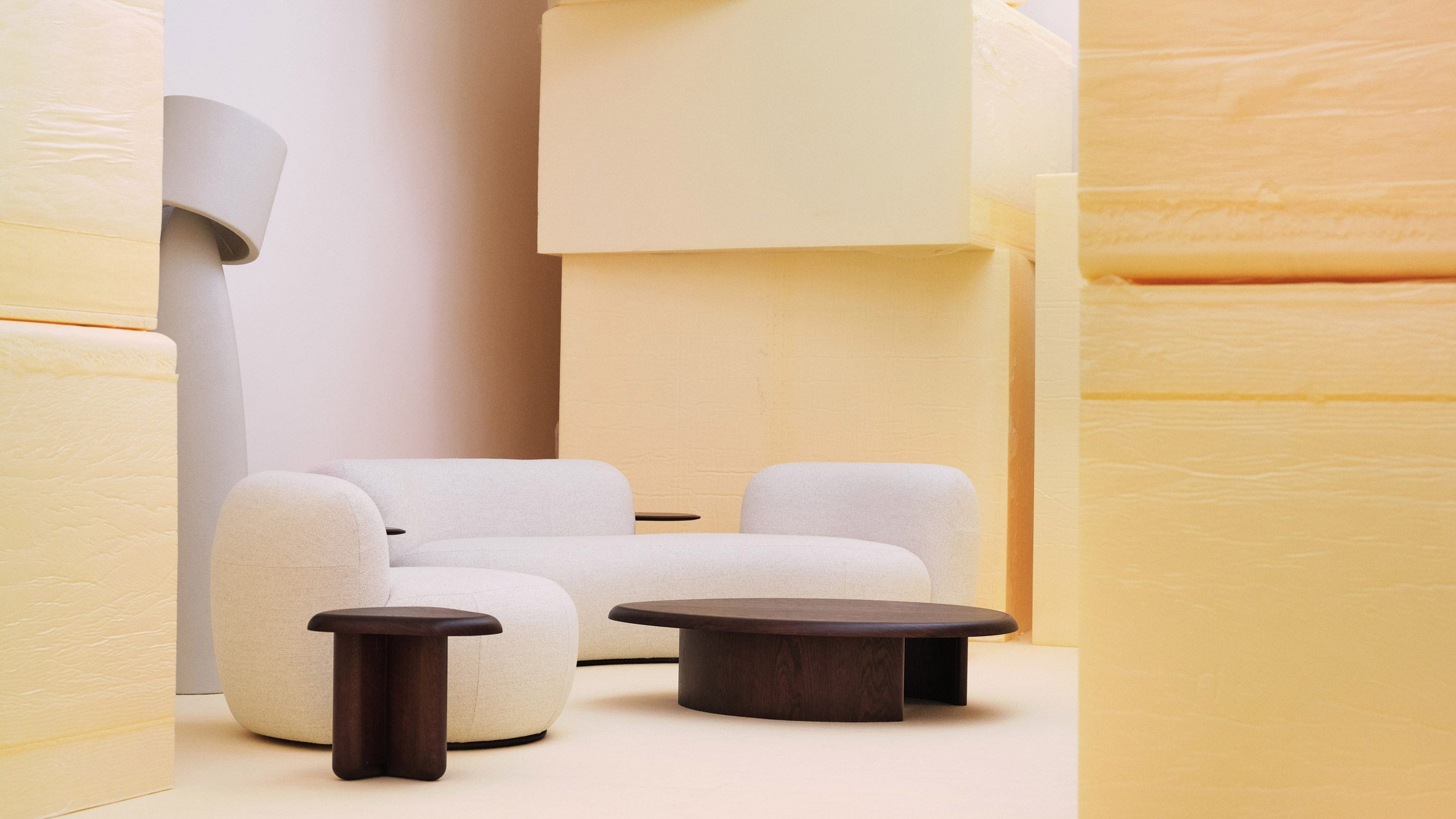Sofa and table in front of yellow blocks