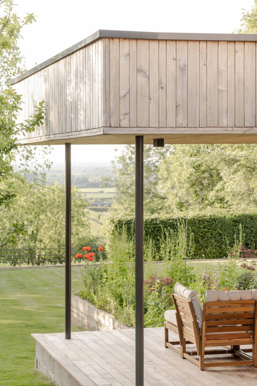 Timber-clad patio overlooking gardens and Thames Valley