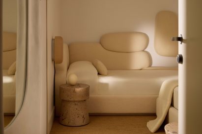 Soft shapes and colours used in a guest bedroom