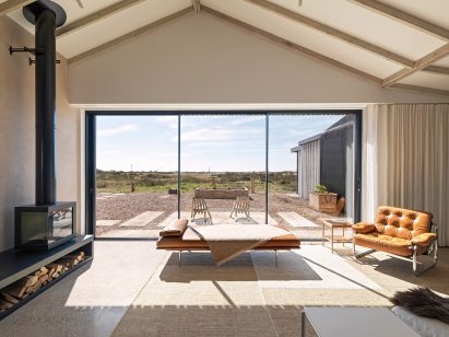 Pared-back living room with coastal views
