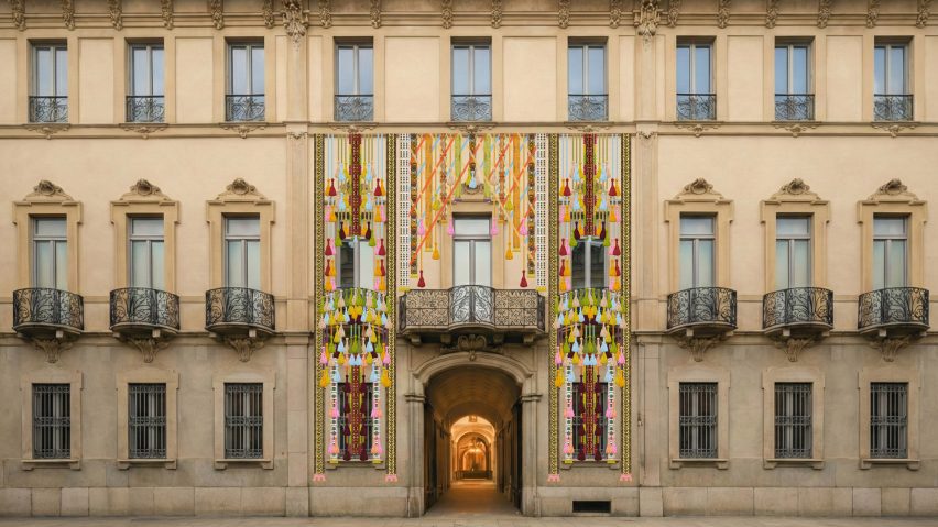 Textile installations hanging across the facade of Palazzo Citterio in Milan