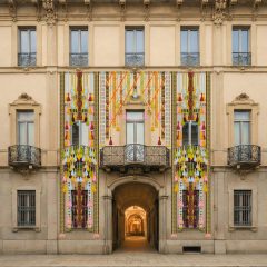Textile installations hanging across the facade of Palazzo Citterio in Milan