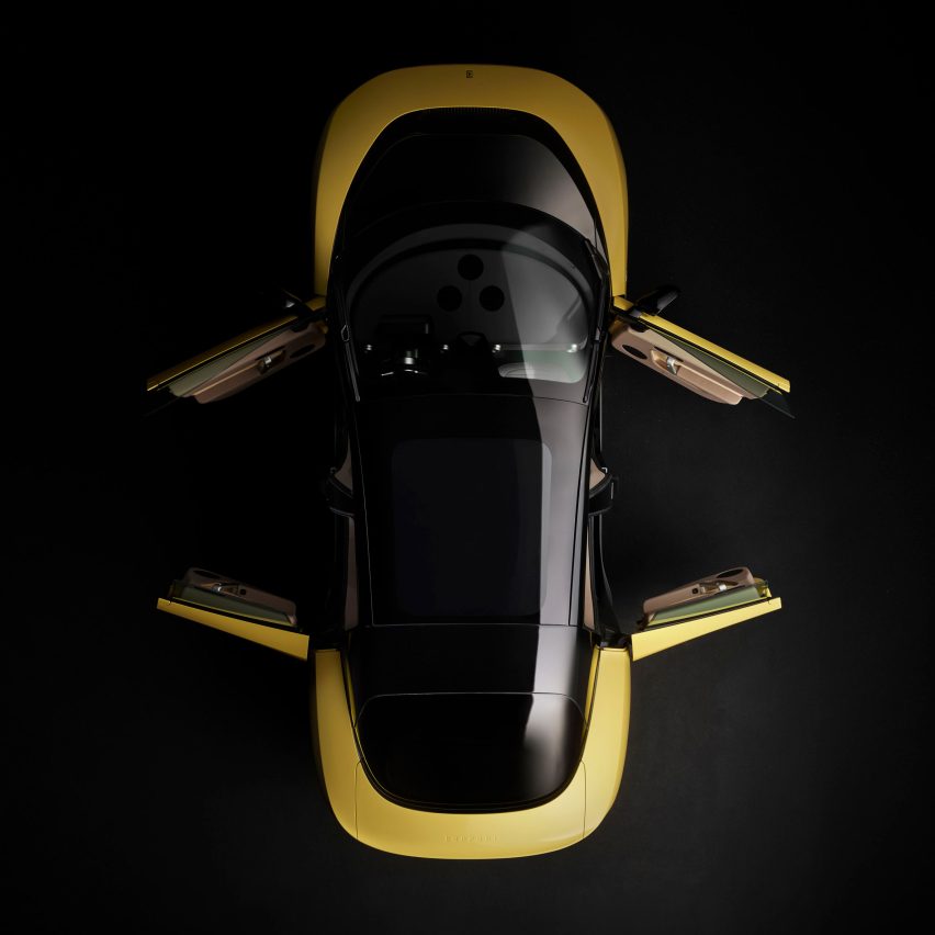 Aerial view of yellow Ferrari Luce with doors open