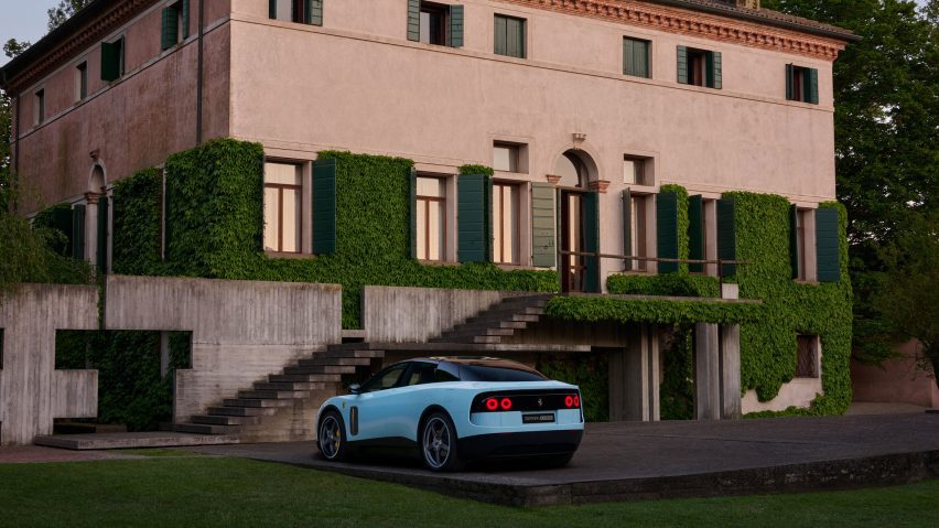 Rear three-quarter view of blue Ferrari Luce