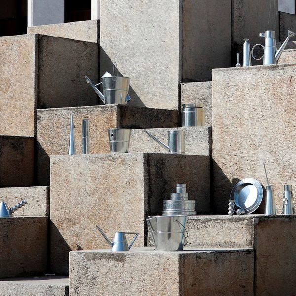 Display of metal craft objects on concrete blocks