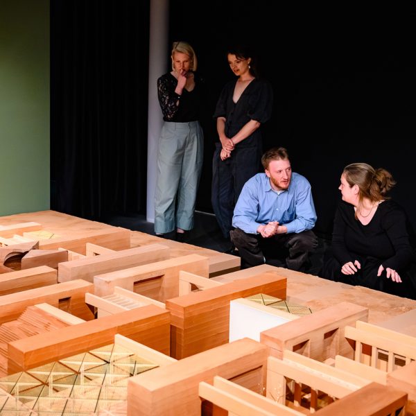Photo of people looking at an architectural structure