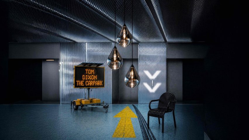 Photo of lighting, a chair and sign by a lift