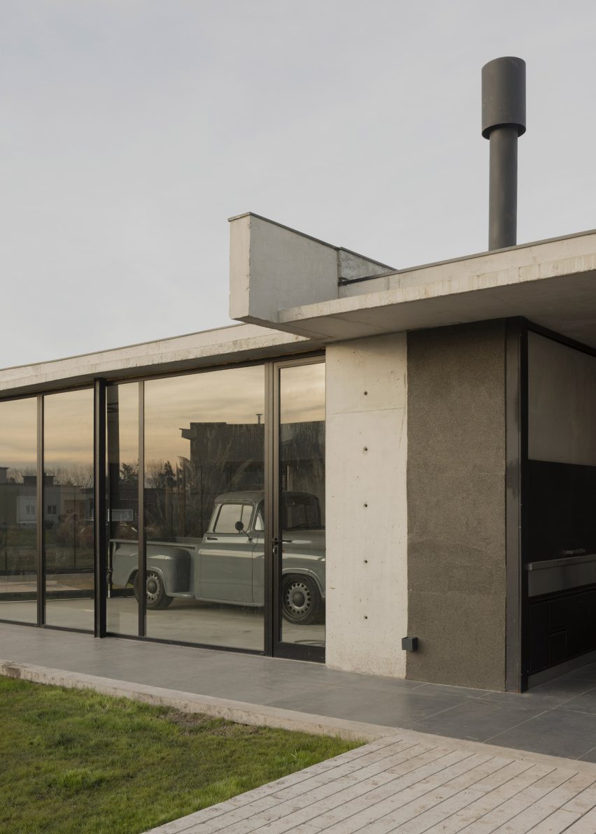 Casa Alba by Ademas Arquitectura, a concrete house with a wall for privacy