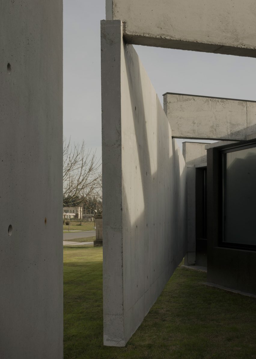 Casa Alba by Ademas Arquitectura, a concrete house with a wall for privacy