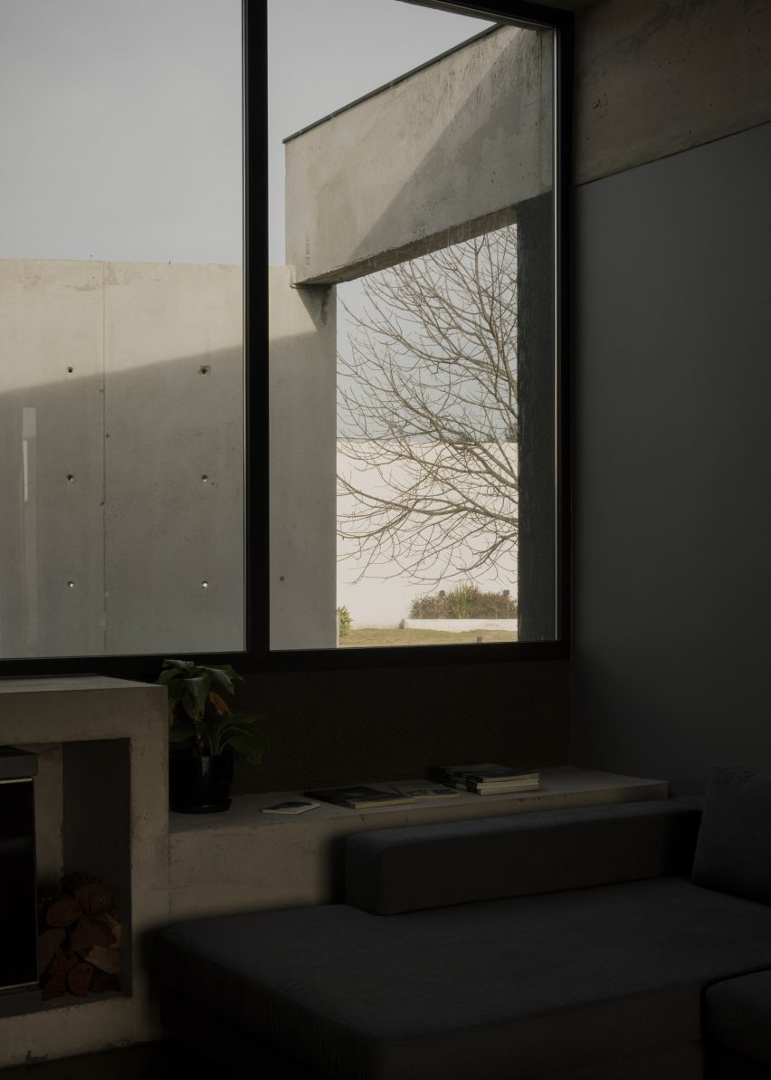 Casa Alba by Ademas Arquitectura, a concrete house with a wall for privacy