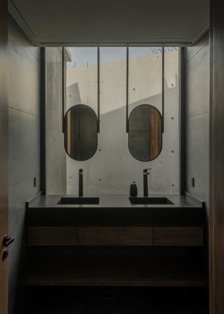Casa Alba by Ademas Arquitectura, a concrete house with a wall for privacy